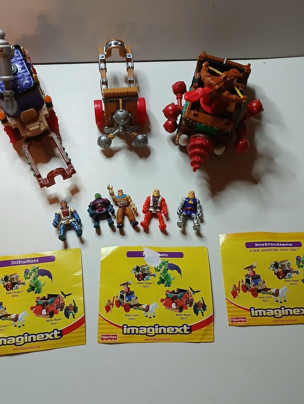 Fisher-Price Imaginext medieval-themed toy vehicles, action figures, and Manuals